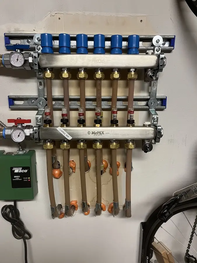 Plumber performing Gas Leak Detection at a residential property in Manchester